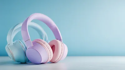 Pastel Colored Wireless Headphones On A Light Blue Background