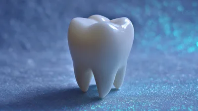 White Molar Tooth Model on Glittering Blue Background