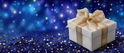 White Gift Box With Gold Ribbon On Starry Background