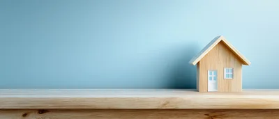 Wooden House Model On A Wooden Table