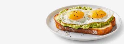 Avocado Toast With Fried Eggs On A Plate
