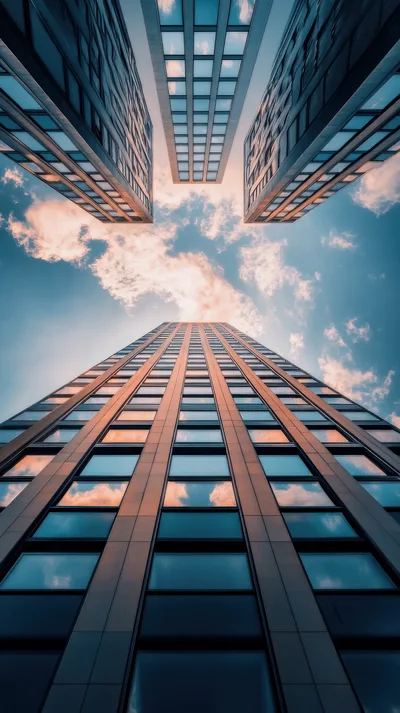 Low Angle View Of Modern Skyscrapers Against Blue Sky