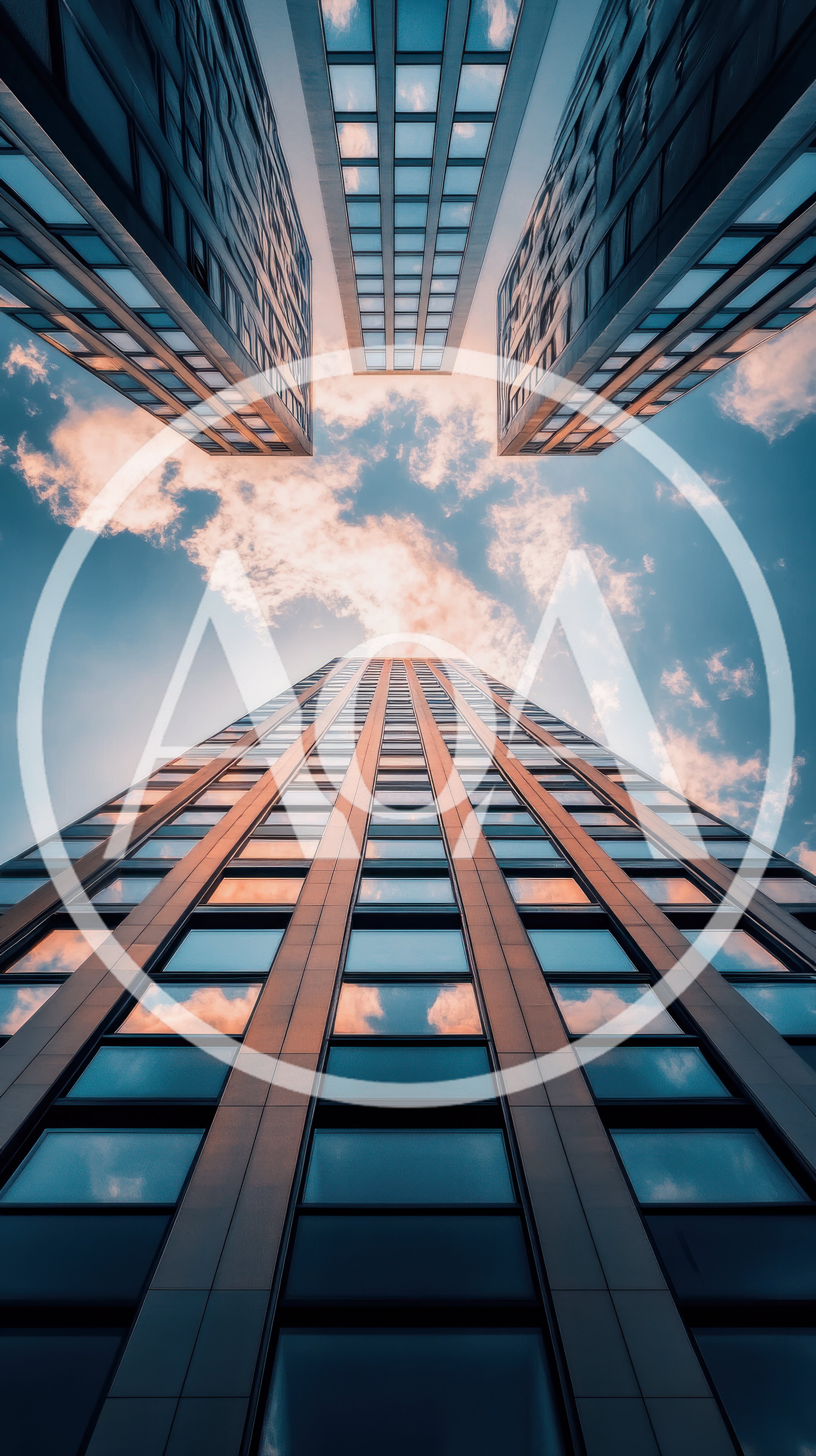 Low Angle View Of Modern Skyscrapers Against Blue Sky