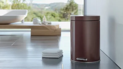 Brown Metal Pedal Trash Can In Modern Bathroom