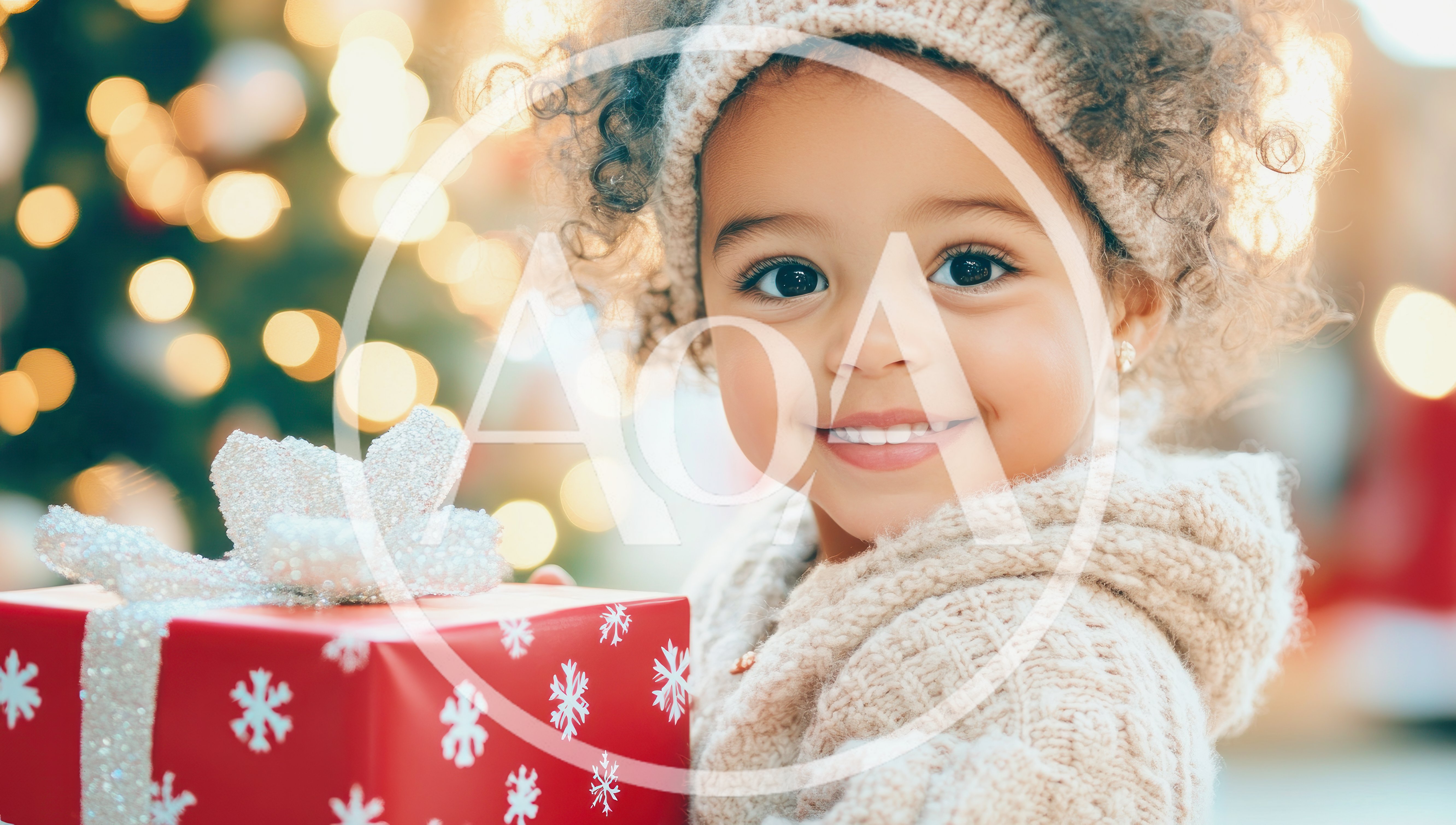 Happy Toddler Holding A Christmas Gift
