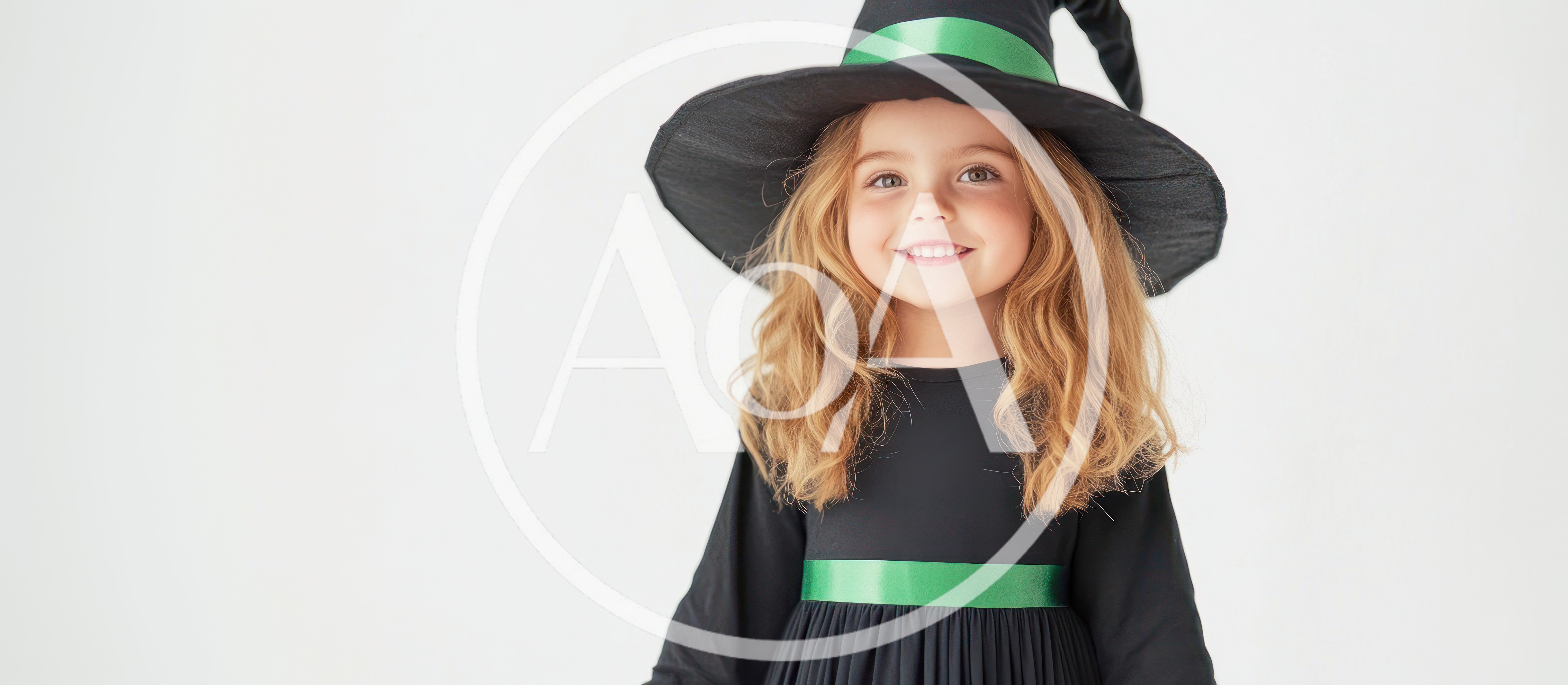 Little Girl Wearing A Witch Costume