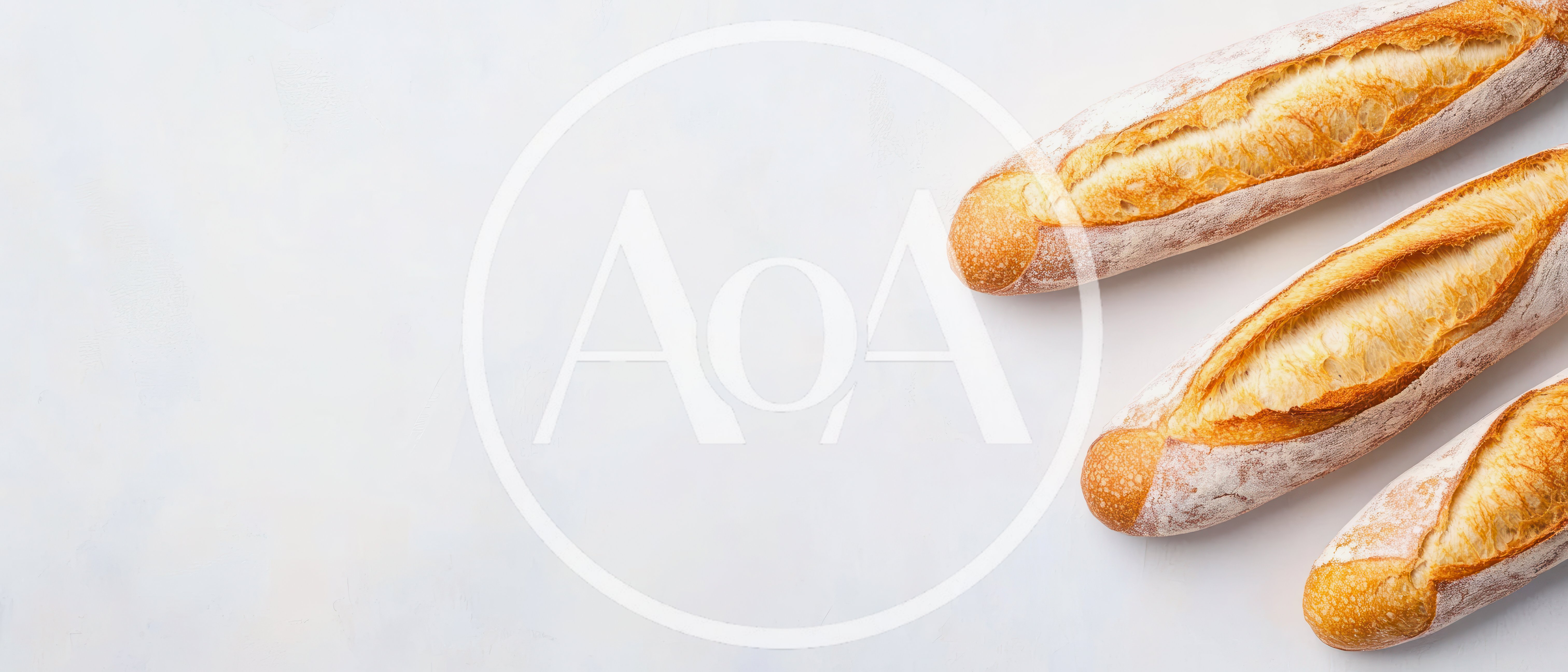Three Freshly Baked French Baguettes On White Background