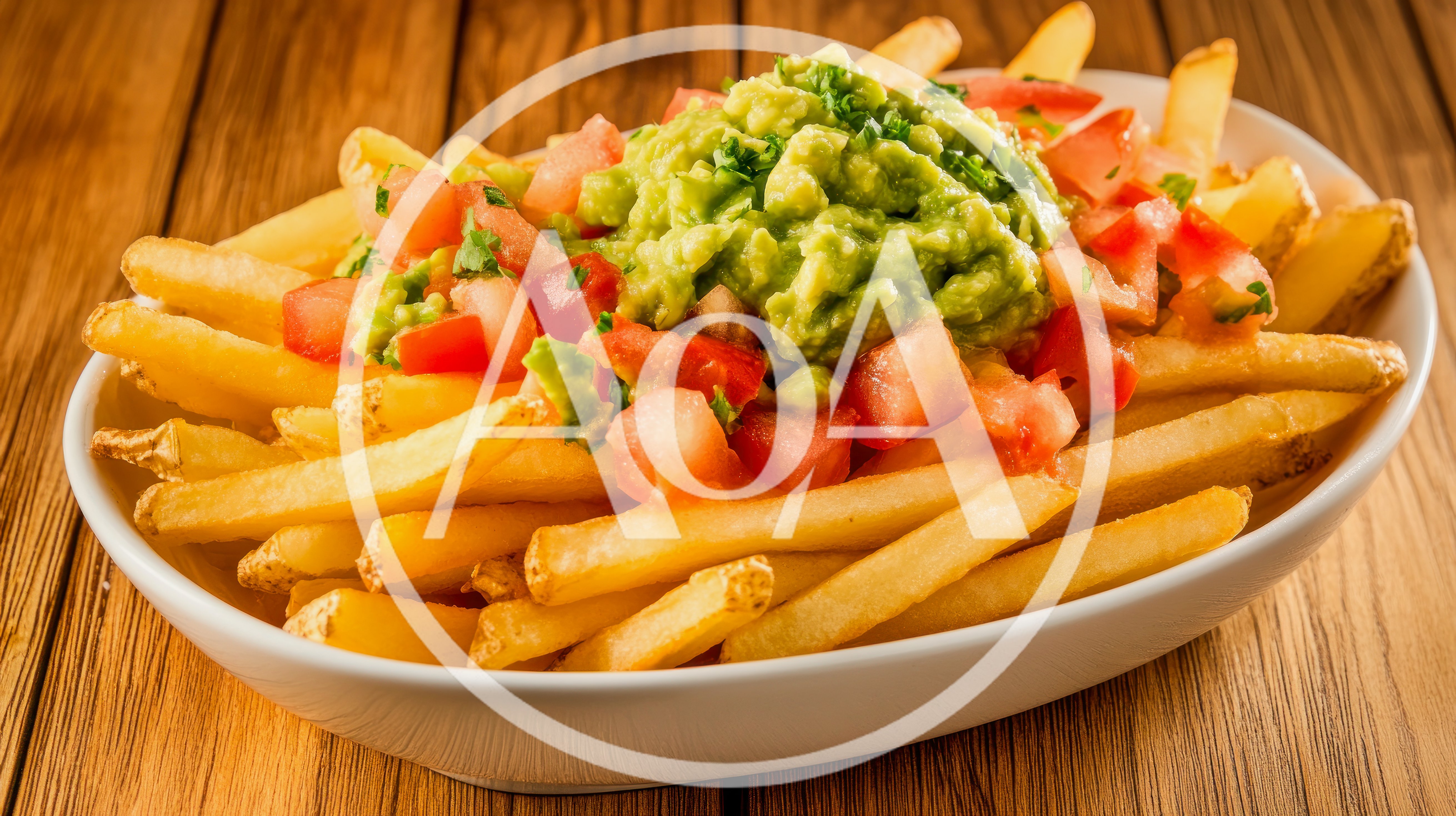 Bowl Of Loaded Guacamole Fries With Diced Tomatoes
