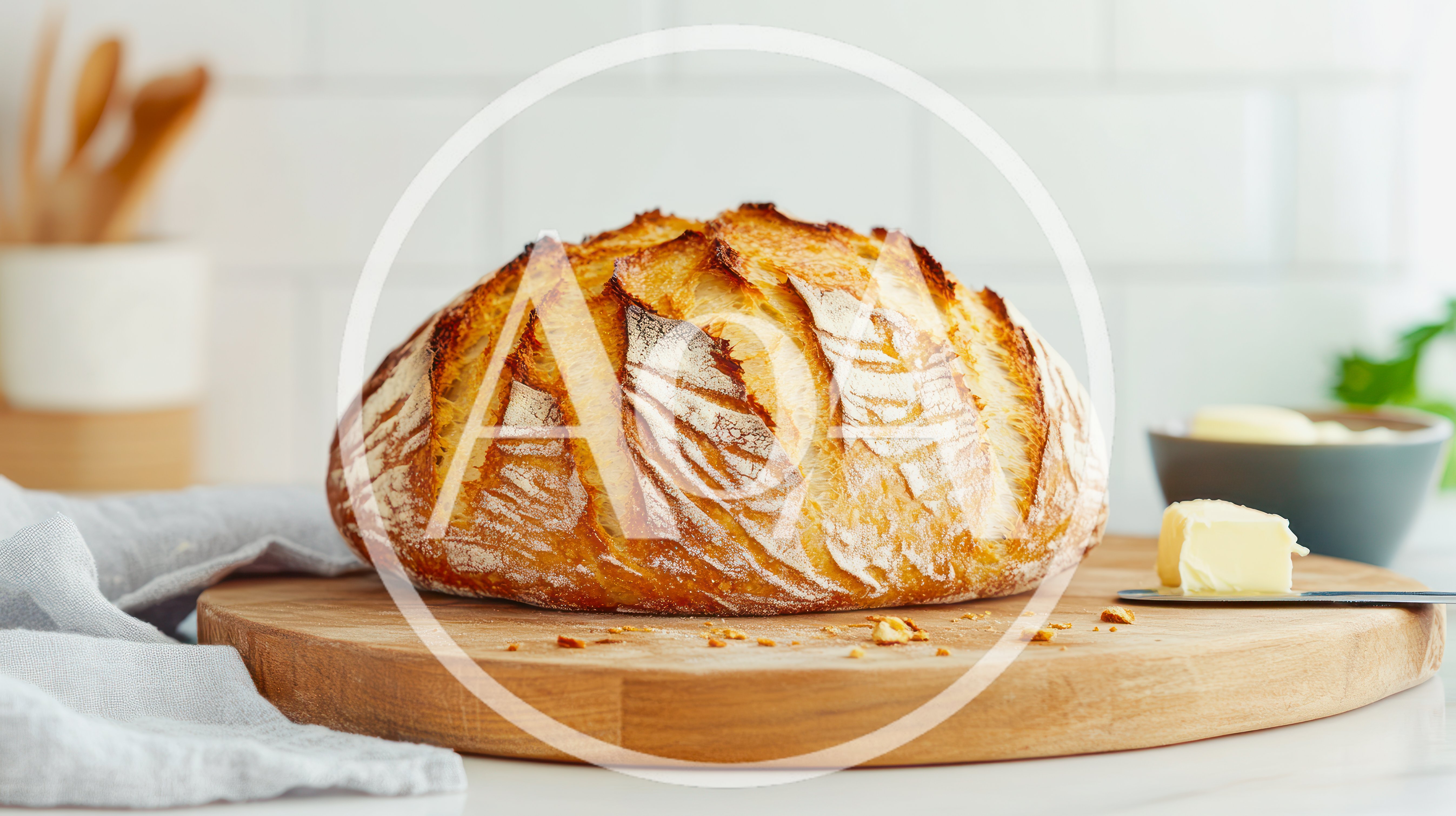 Freshly Baked Sourdough Bread Loaf On Wooden Board