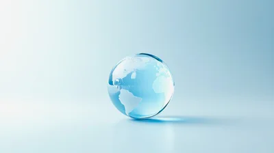 Glass Globe With World Map On Light Blue Background