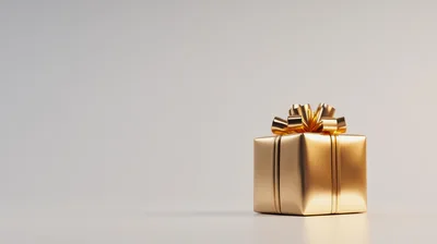 Golden Gift Box With Ribbon On Neutral Background