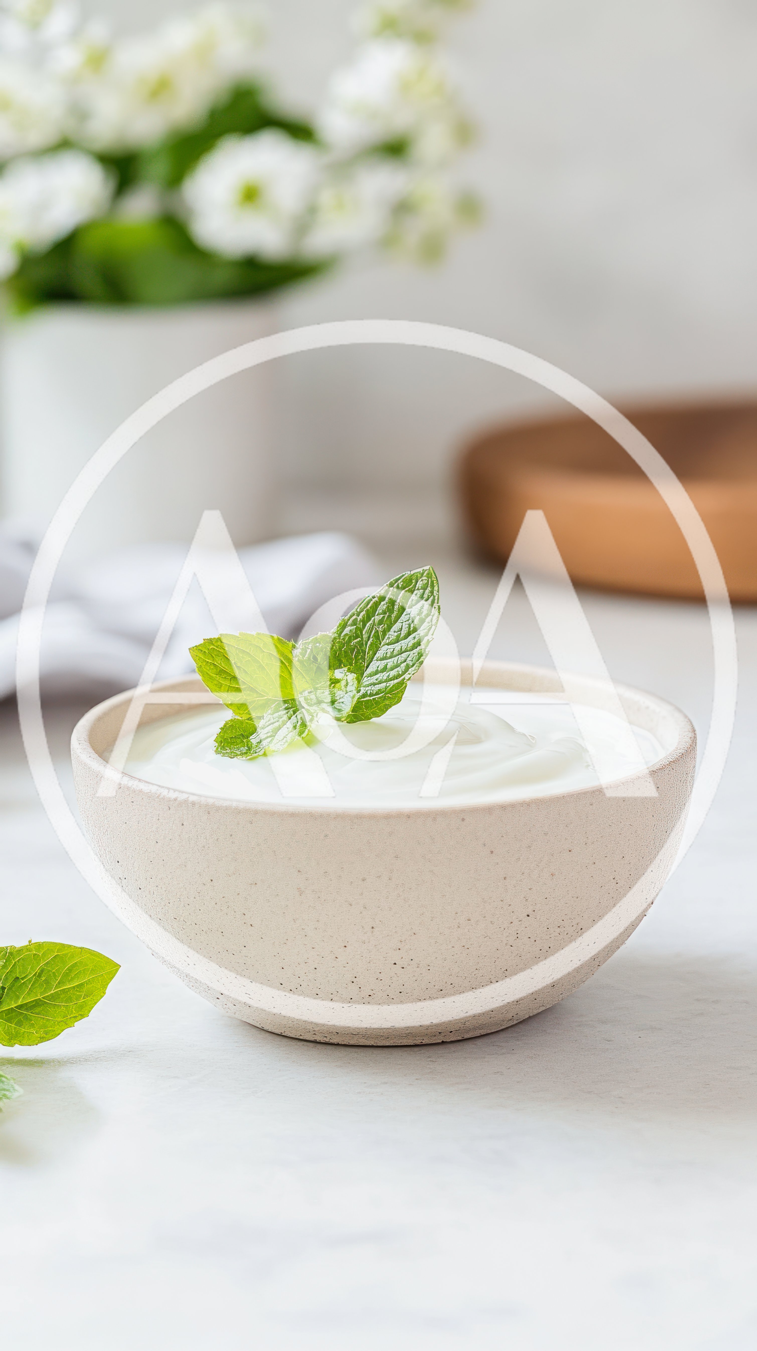 Bowl Of Creamy Yogurt Garnished With Fresh Mint Leaves