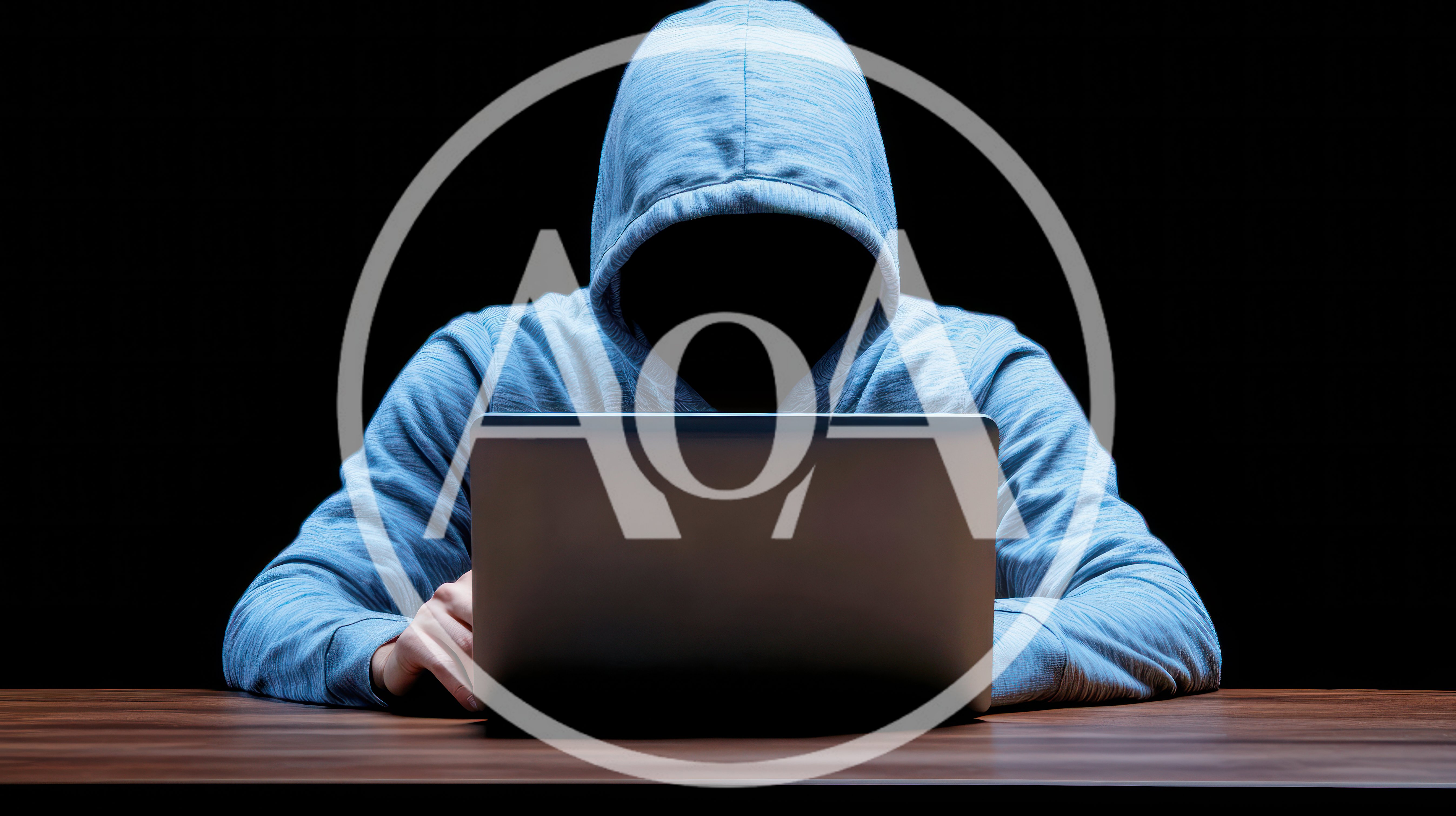 Anonymous Hacker Working On A Laptop In The Dark