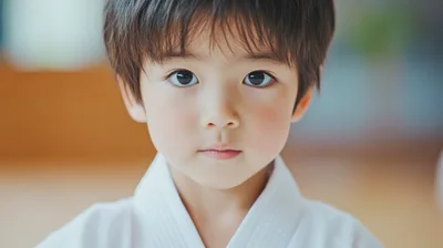 Young Asian Boy Wearing White Karate Gi