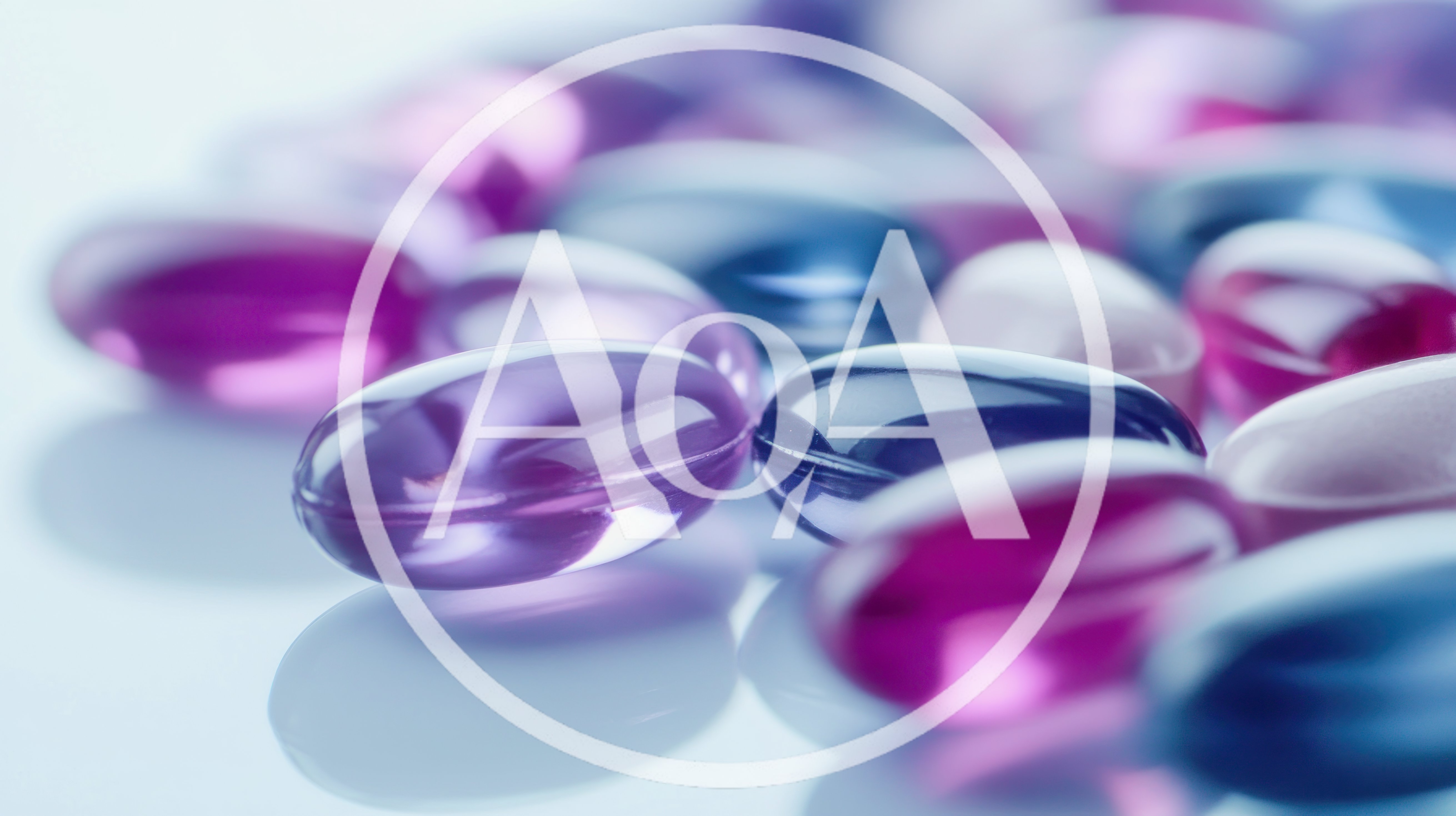 Purple And Blue Gelatin Capsules On Reflective Surface
