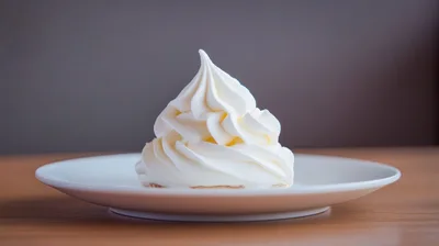 Swirl Of Vanilla Soft Serve Ice Cream On Plate