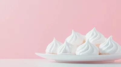 White Meringue Cookies on a White Plate