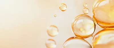 Abstract Golden Oil Bubbles Floating in Liquid
