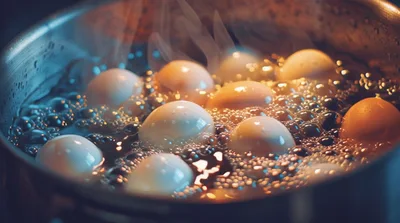 Eggs Boiling In A Stainless Steel Pot