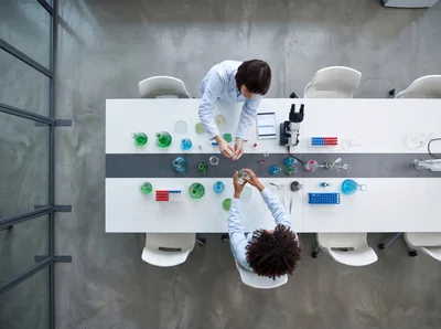 Two Scientists Collaborating in a Modern Laboratory