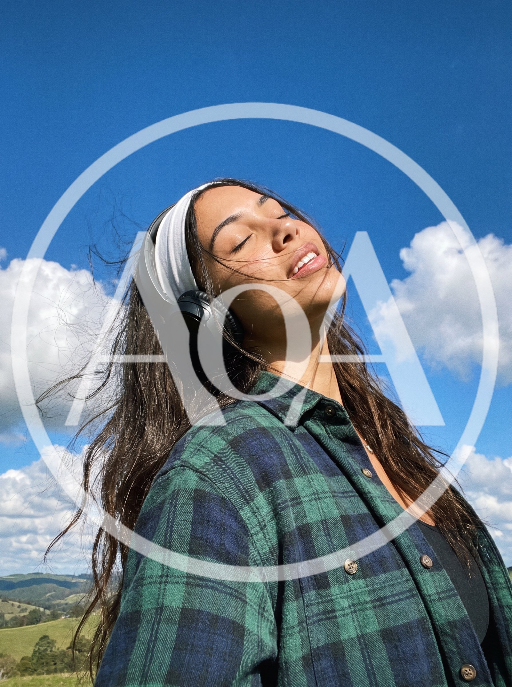 Young Woman Listening To Music Outdoors