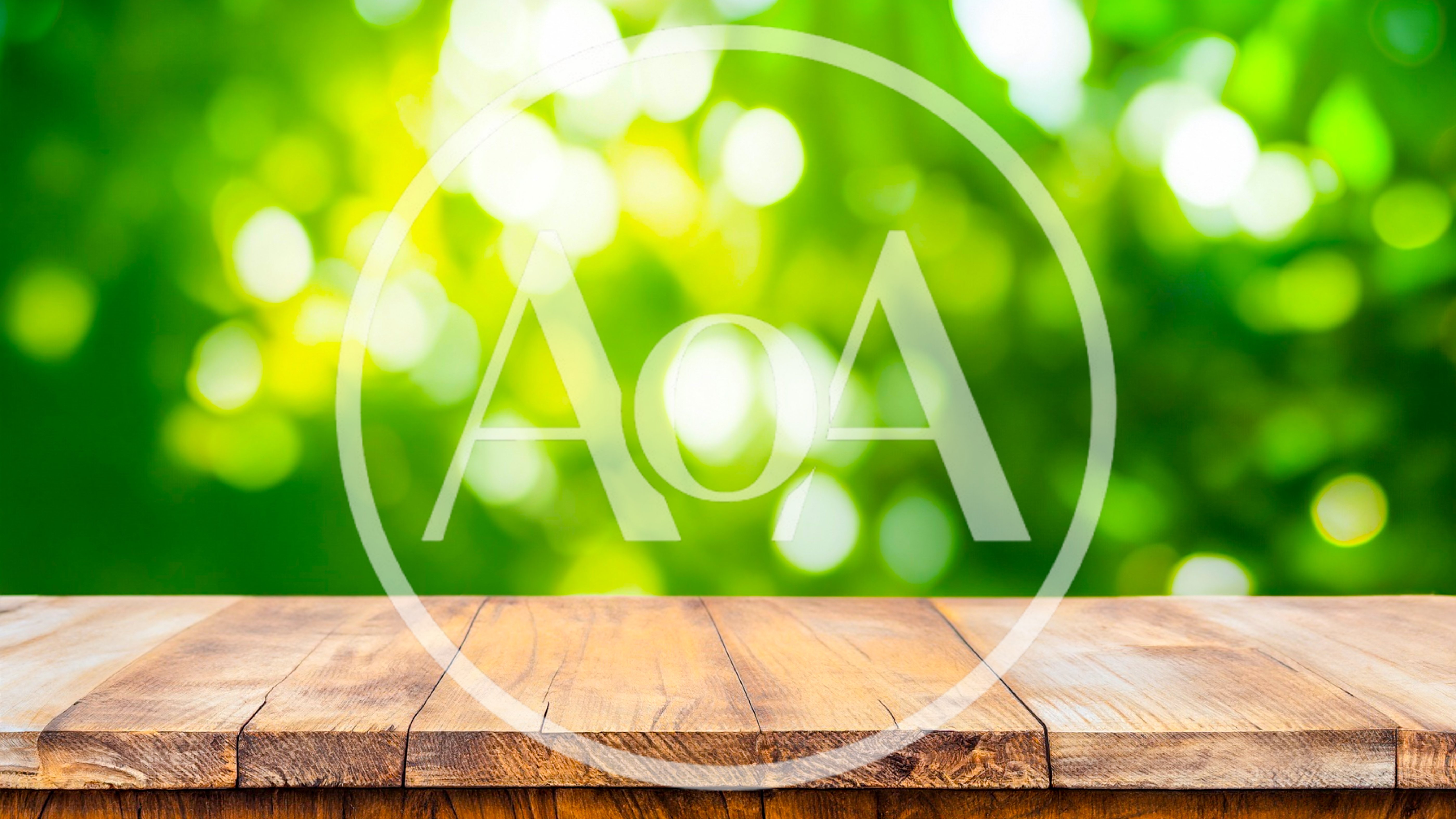 Empty Wooden Table Against Blurred Green Nature Background