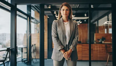 Professional Businesswoman Standing In A Modern Office