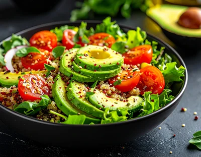 Fresh Avocado and Quinoa Salad in Black Bowl