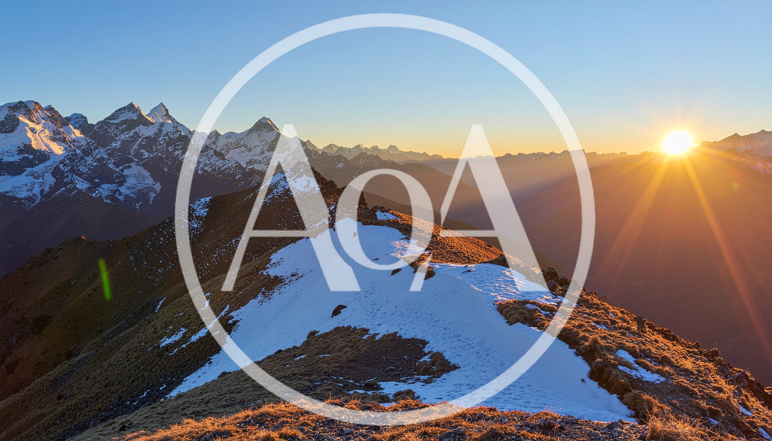 Sunrise Over Snow Capped Mountain Peaks