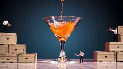 Miniature Workers Preparing A Large Cocktail Glass