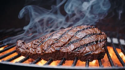 Juicy Beef Steak Grilling Over Open Flame