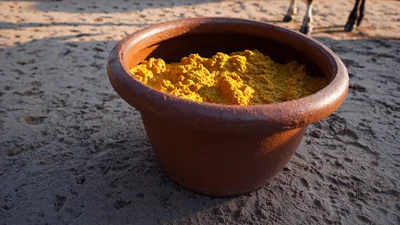Turmeric Powder In A Brown Plastic Bowl