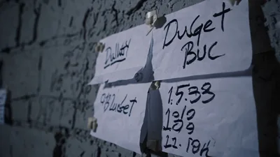 Handwritten Notes Taped To A Rough Grey Brick Wall