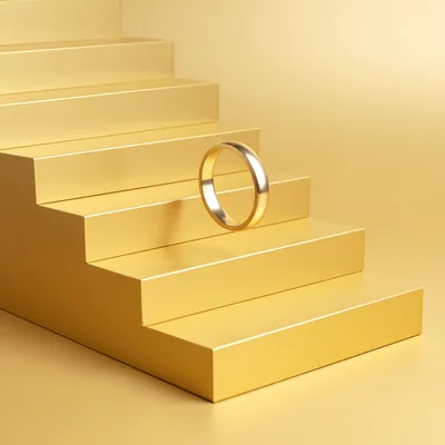 Gold Wedding Ring Floating On Minimalist Golden Stairs