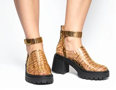 Model Wearing Gold Metallic Cage Platform Shoes