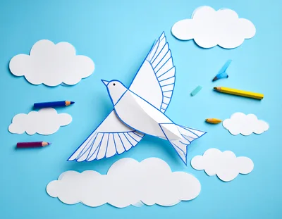 Paper Craft Bird Flying Among Paper Clouds
