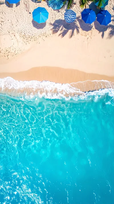 Aerial View Of Tropical Beach With Blue Umbrellas