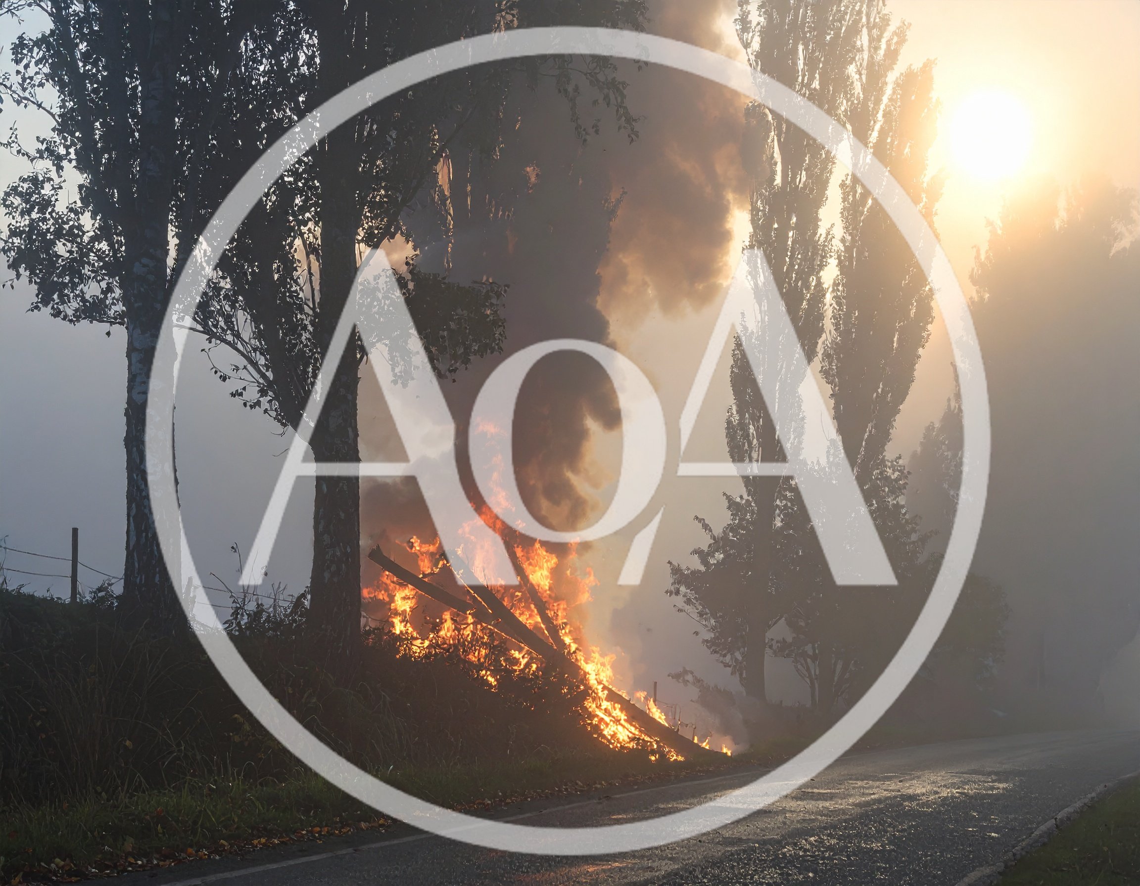 Large Bonfire Burning Beside A Rural Road