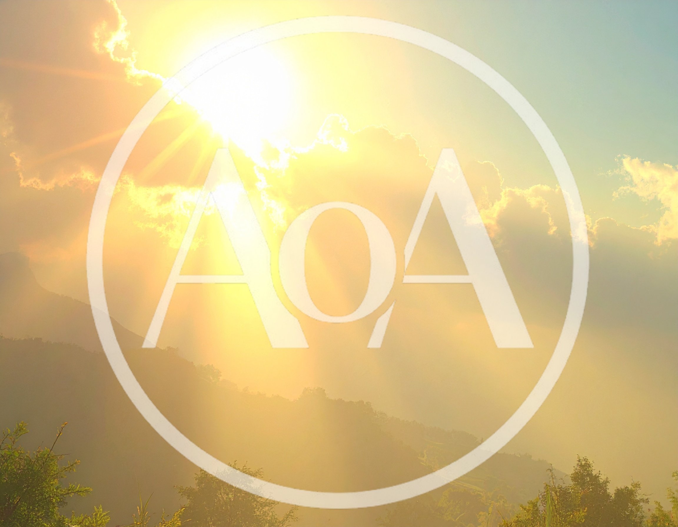 Golden Sun Rays Over Misty Mountain Landscape