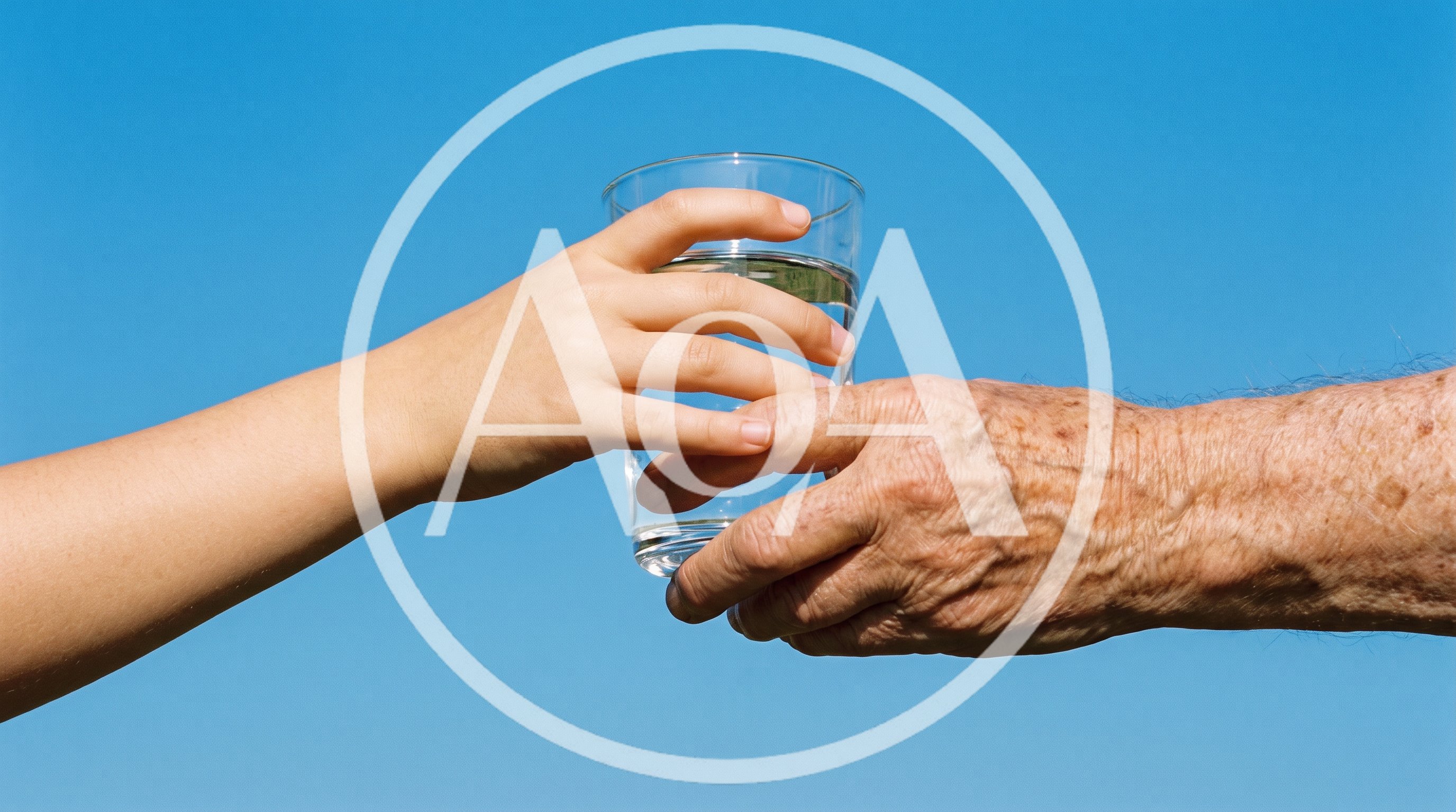Young Hand Passing Glass of Water to Elderly Hand
