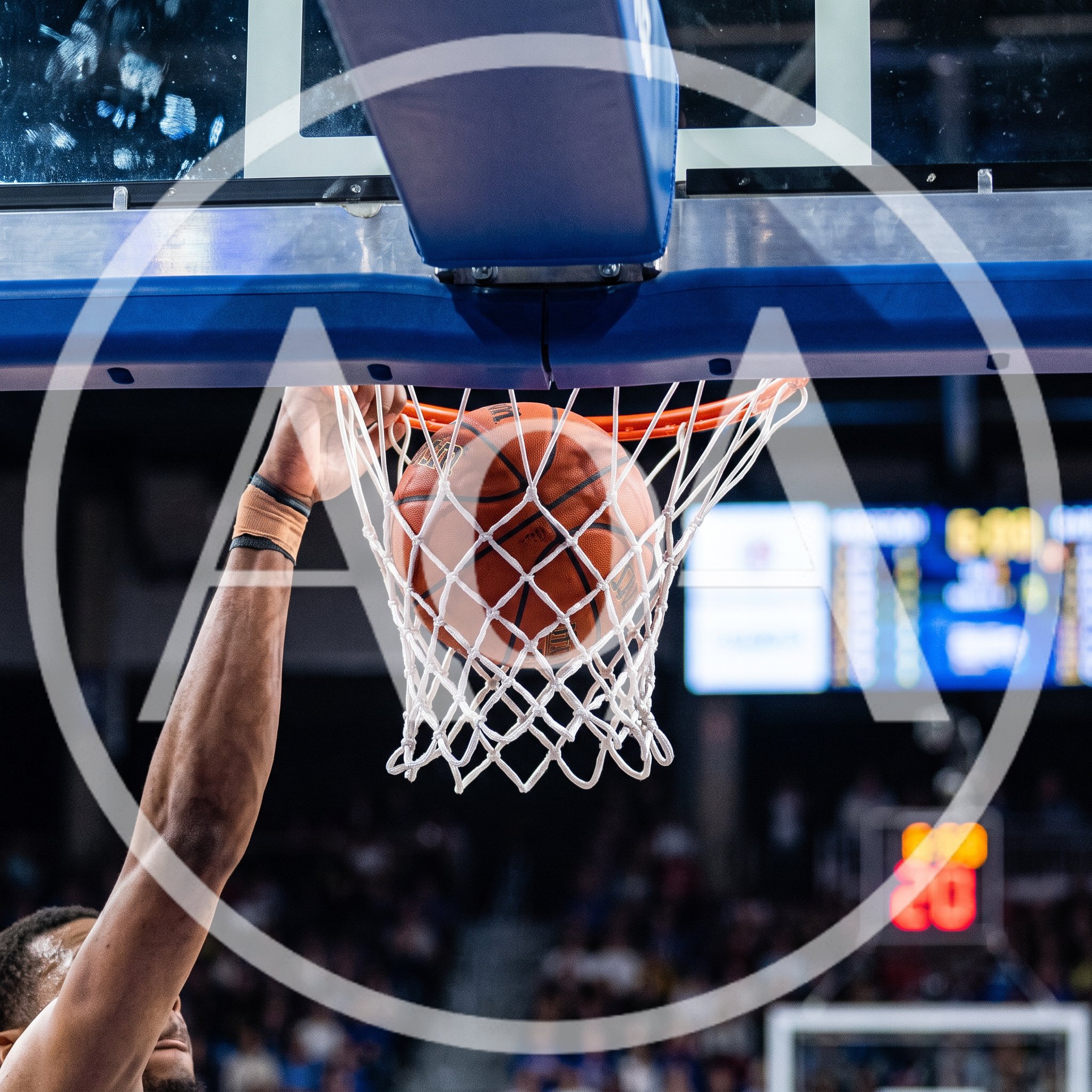 Basketball Player Performing A Powerful Slam Dunk