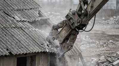 Excavator Demolishing Old Building With Hydraulic Shear