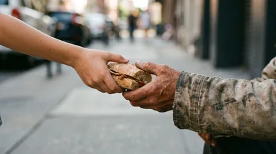 Person Giving A Sandwich To A Homeless Individual