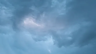 Lightning Flashing Inside Dark Storm Clouds