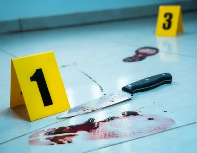 Crime Scene Investigation With Knife And Bloody Footprints
