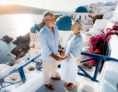 Senior Couple Holding Hands Overlooking Santorini