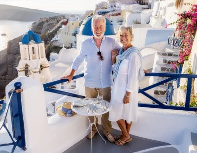 Senior Couple Enjoying Coffee on Santorini Terrace