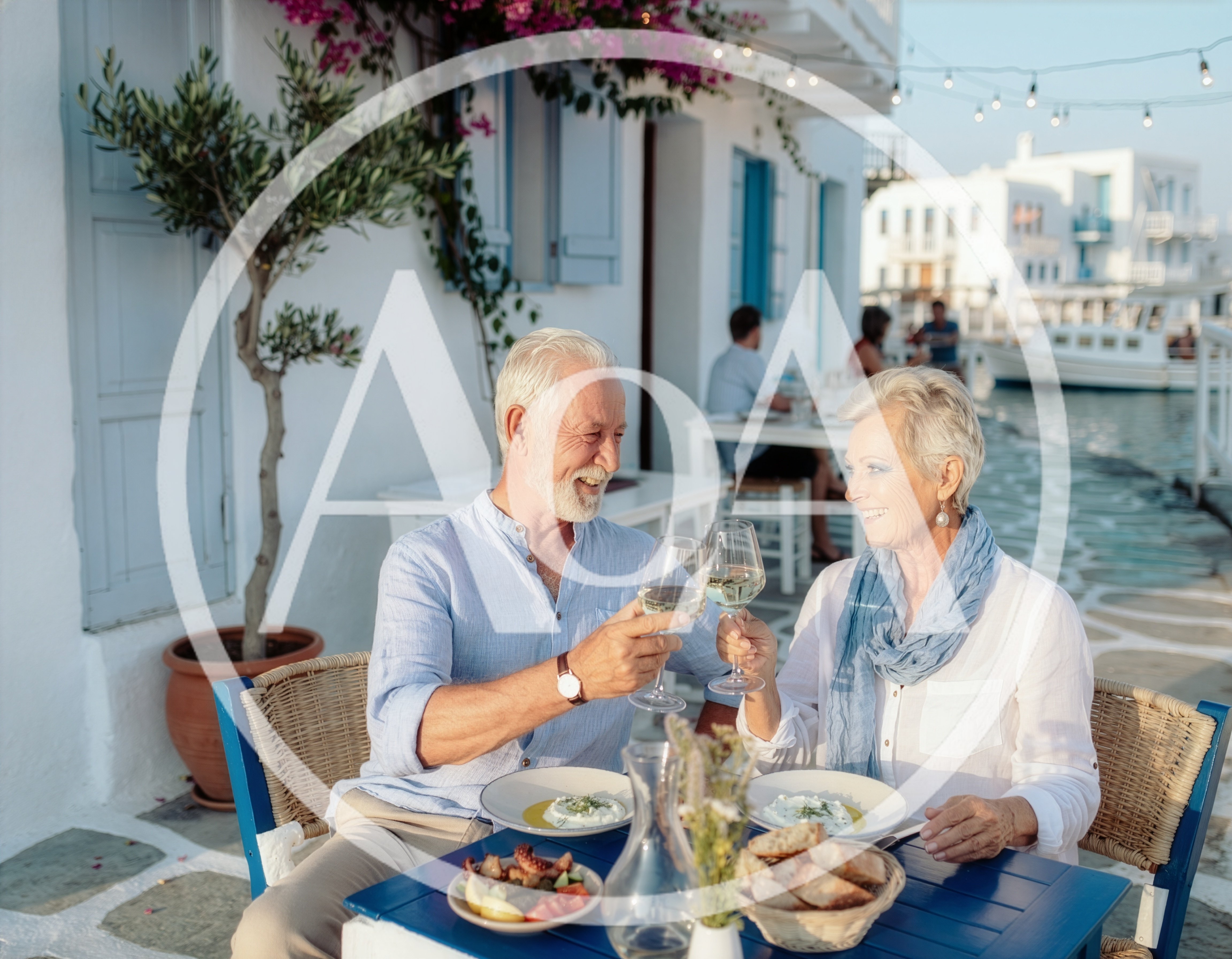 Senior Couple Toasting With Wine At A Greek Restaurant