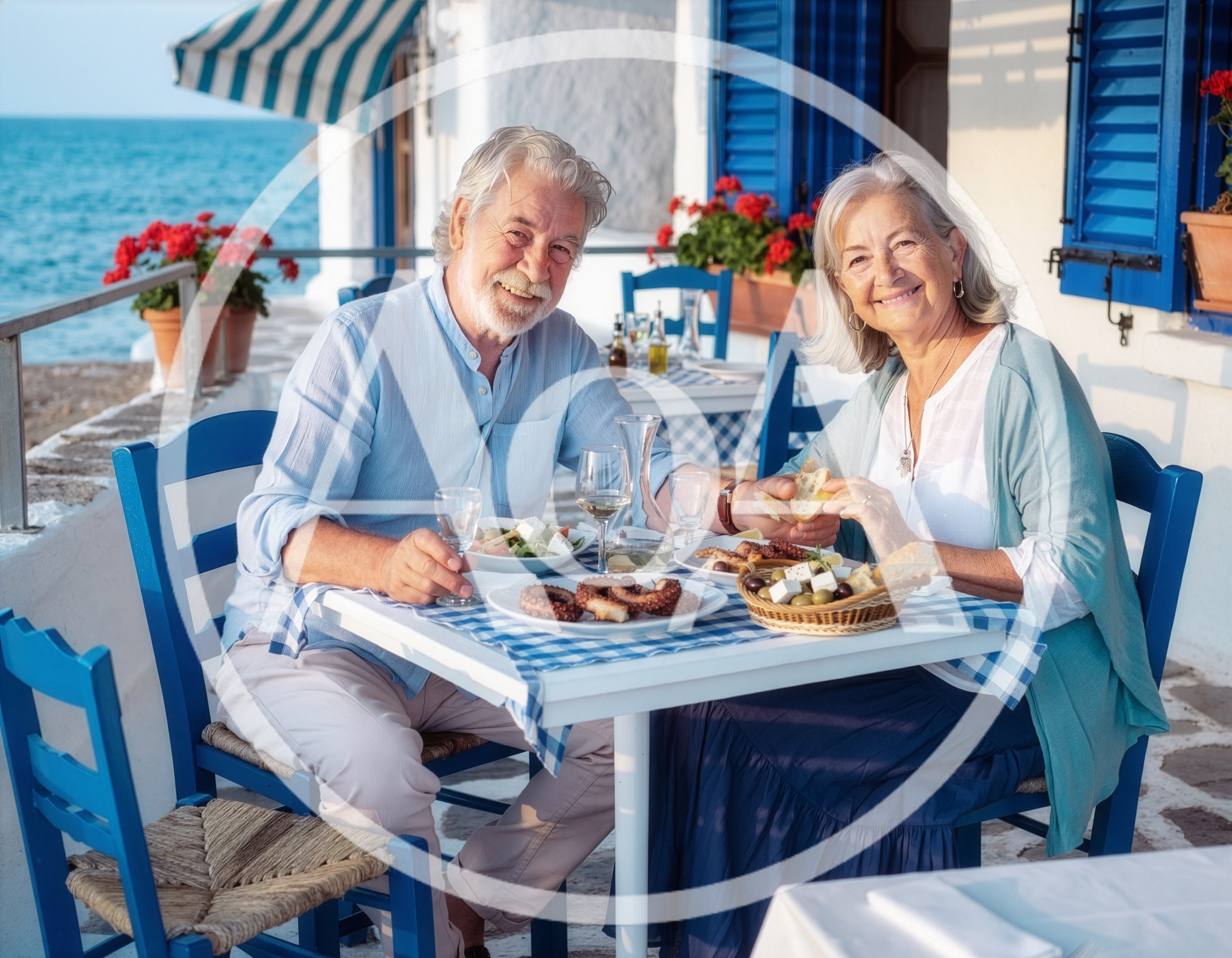 Senior Couple Enjoying Mediterranean Lunch By The Sea