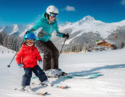 Mother Teaching Young Child To Ski In Mountains